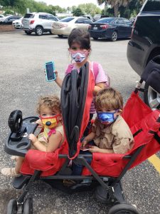 Masked kids, zoo family outing